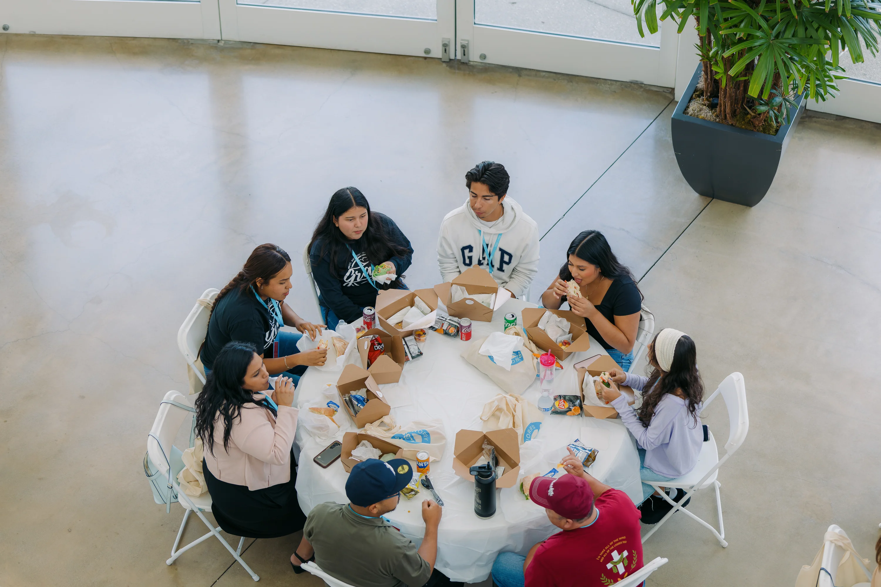 A group sharing a meal around a table